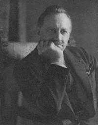 Lord Dunsany, seated in suit and tie.