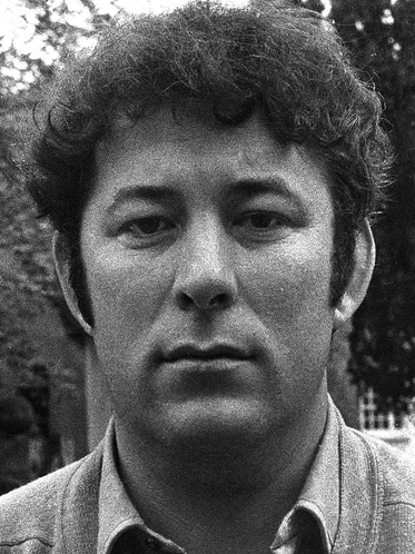 Black and white image of Heaney's face as a young man. Serious expression.